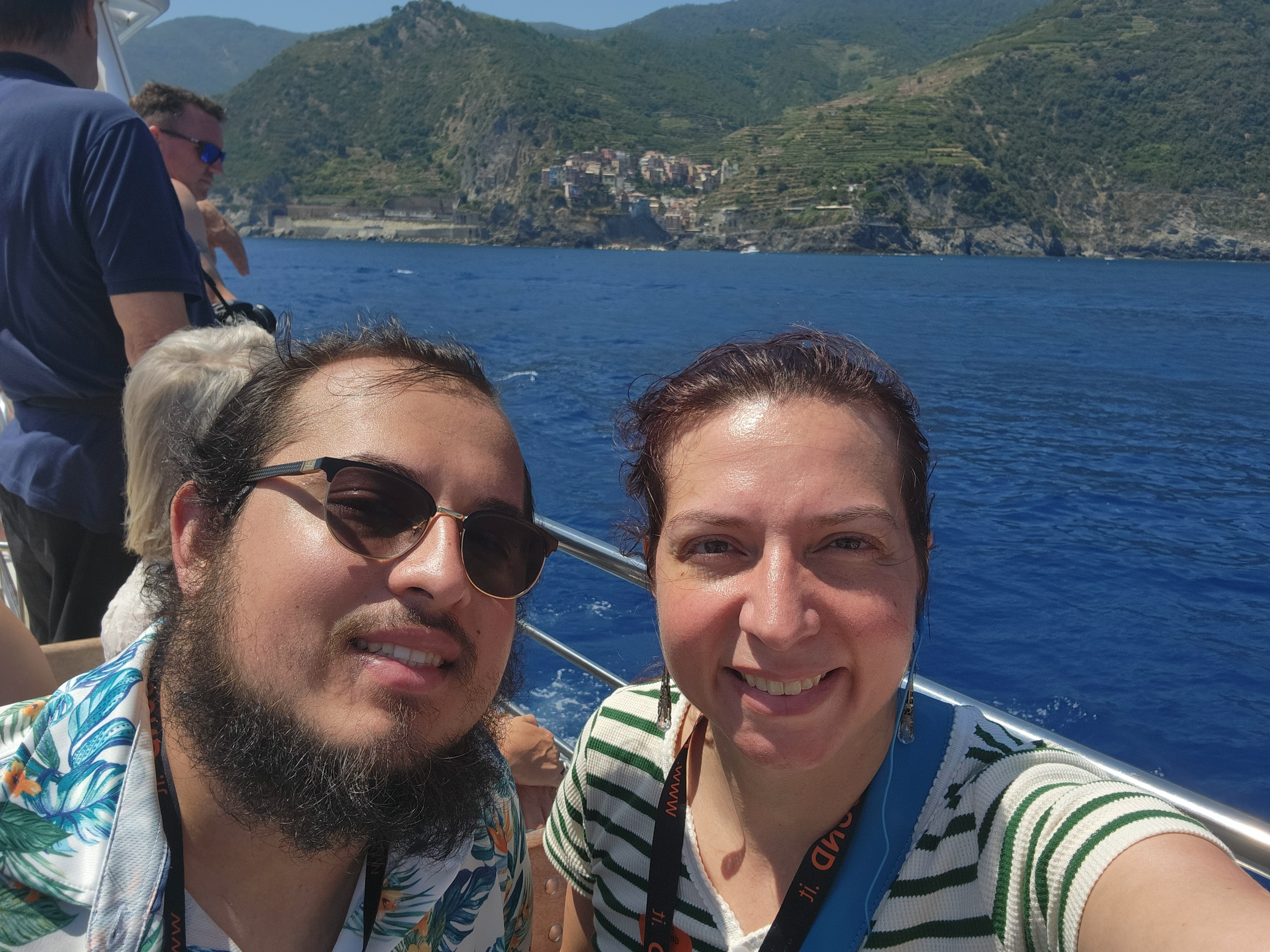 Alex and Jessica on a boat along the Cinque Terre coast in Italy